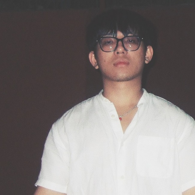 Yoihen Elangbam in a white shirt and glasses